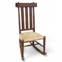 An Arts and Crafts oak rocking chair - Thumbnail 1