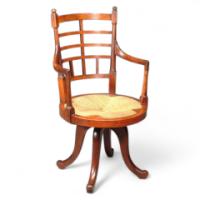 E W Godwin for Collinson and Lock. A rare walnut Old English or Jacobean swivel armchair - Thumbnail 1