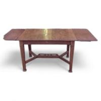 In the Style of John Ednie. an Arts and Crafts Oak Inlaid Extending Dining Table.