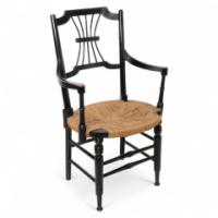 Liberty & Co., An English Aesthetic Movement Ebonized Armchair with Seagrass Seat - Thumbnail 1