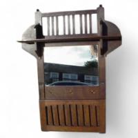 Leonard Wyburd for Liberty and Co. A rare Liberty and Co Arts and Crafts oak wall mirror/paper rack - Thumbnail 1