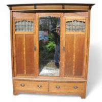 Goodhall, Lambs and Heighway. A Glasgow School Arts and Crafts oak treble wardrobe in the manner of M H Baillie Scott - Thumbnail 1