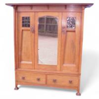 Harris Lebus. An Arts and Crafts oak treble wardrobe in the Glasgow Style - Thumbnail 1