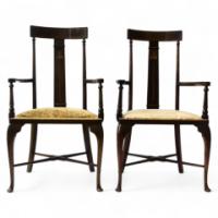 A pair of Arts and Crafts armchairs with stylised floral details - Thumbnail 1