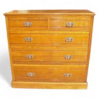 A Good Quality Arts & Crafts Oak Chest of Drawers with Stylised Copper Handles