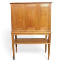 An Arts and Crafts oak cabinet with large internal cupboard - Thumbnail 1