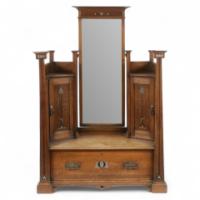 An impressive Arts and Crafts oak dressing table with pewter and ebony stylised floral inlays. - Thumbnail 1