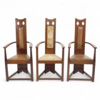 M. H. Baillie Scott, attributed. Three Arts and Crafts High-back oak armchairs