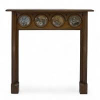 Dr. C. Dresser for Barnard, Bishop & Barnard. An Aesthetic Movement Fireplace with Linthorpe Pottery Circular Plaques