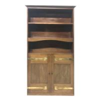 Liberty & Co., A Slim Arts & Crafts Walnut Bookcase with Stylised Copper Hinges