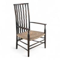 Liberty & Co., An Arts & Crafts Rush Seat Armchair with Wavy Shaped Back Slats - Thumbnail 1