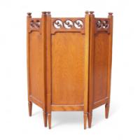An Arts & Crafts Folding Oak Firescreen with Stylised Ying Yang Carved Fretwork