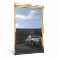 A Large Gothic Revival Gilt and Incised Mirror