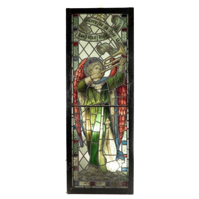 A Pre-Raphaelite stained glass window of the Archangel Gabriel blowing a trumpet.