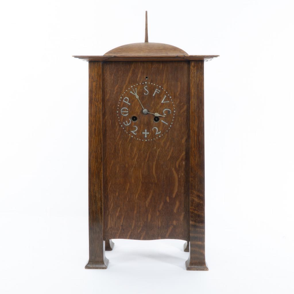 C. F. A. Voysey Arts and Crafts oak mantel clock with pewter-inlaid dial
