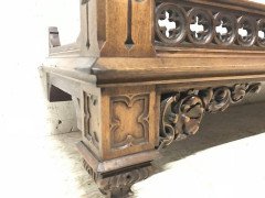 A Gothic Revival walnut wall shelf with carved foliate details - Thumbnail 2