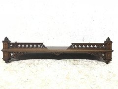 A Gothic Revival walnut wall shelf with carved foliate details - Thumbnail 3