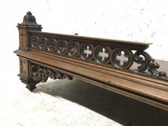 A Gothic Revival walnut wall shelf with carved foliate details - Thumbnail 5