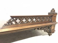 A Gothic Revival walnut wall shelf with carved foliate details - Thumbnail 6