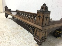 A Gothic Revival walnut wall shelf with carved foliate details - Thumbnail 8
