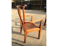 Arthur Simpson. An armchair with shaped back and original ratten drop - Thumbnail 5