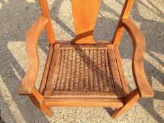 Arthur Simpson. An armchair with shaped back and original ratten drop - Thumbnail 6