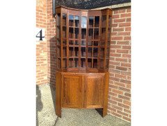 A walnut corner cupboard after a design by Ernest Gimson and Sidney Barsnley - Thumbnail 1