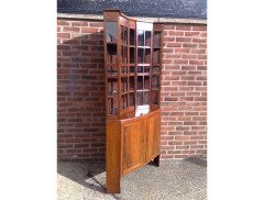A walnut corner cupboard after a design by Ernest Gimson and Sidney Barsnley - Thumbnail 2