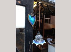 A pair of Arts and Crafts copper wall lights with peacock blue enamel heart shaped back plates. - Thumbnail 2