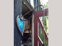 A pair of Arts and Crafts copper wall lights with peacock blue enamel heart shaped back plates. - Thumbnail 3