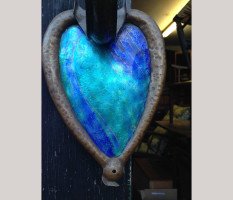 A pair of Arts and Crafts copper wall lights with peacock blue enamel heart shaped back plates. - Thumbnail 5