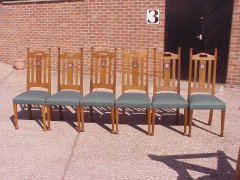 G M Ellwood for J S Henry. A set of six Arts and Crafts oak dining chairs inlaid with pewter and Ebony hearts - Thumbnail 1