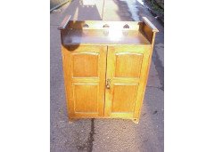 Wylie and Lochhead. An Arts and Crafts boot oak cupboard - Thumbnail 1