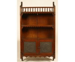 E W Godwin (attributed). An oak hanging bookcase, with portrait medallion roundels in moulded vulcanite - Thumbnail 1