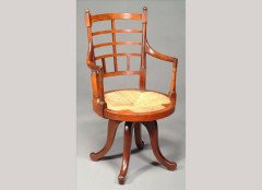 E W Godwin for Collinson and Lock. A rare walnut Old English or Jacobean swivel armchair - Thumbnail 1