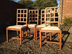 Heals of London. A set of four Arts and Crafts oak lattice back dining chairs - Thumbnail 1