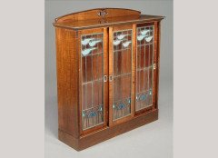 George Logan for Wylie and Lochhead. A carved walnut display cabinet - Thumbnail 1