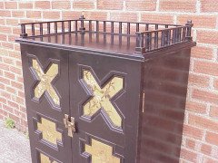 Dr Christopher Dresser (attributed). An ebonised music cabinet, with six painted panels attributed to Moyr Smith - Thumbnail 4
