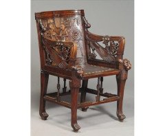 An early Egyptian Revival King Tut carved walnut elbow chair - Thumbnail 1
