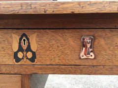 G M Ellwood for J S Henry. An Arts Crafts oak desk inlaid with stylised floral panels - Thumbnail 12