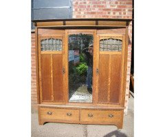 Goodhall, Lambs and Heighway. A Glasgow School Arts and Crafts oak treble wardrobe in the manner of M H Baillie Scott - Thumbnail 1