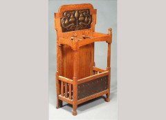 Shapland and Petter. An oak and embossed copper stickstand with stylised plant and roundel embossed panel - Thumbnail 1