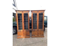 A pair of Arts and Crafts oak glazed bookcases over a lower cupboard - Thumbnail 2