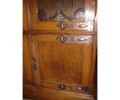 A pair of Arts and Crafts oak glazed bookcases over a lower cupboard - Thumbnail 5
