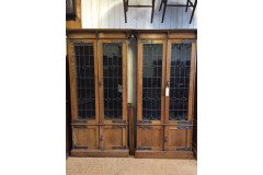A pair of Arts and Crafts oak glazed bookcases over a lower cupboard - Thumbnail 7