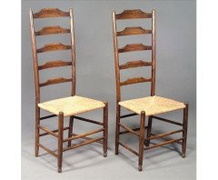 A pair of green stained ash and beech ladder back chairs, with re-rushed seats. - Thumbnail 1