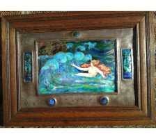 A well executed Arts and Crafts enamelled wall plaque with a Mermaid beckoning a ship - Thumbnail 1