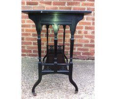 An ebonised oblong sidetable with subtle carved details - Thumbnail 3