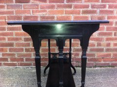 An ebonised oblong sidetable with subtle carved details - Thumbnail 4