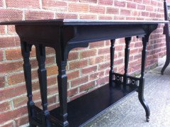 An ebonised oblong sidetable with subtle carved details - Thumbnail 5